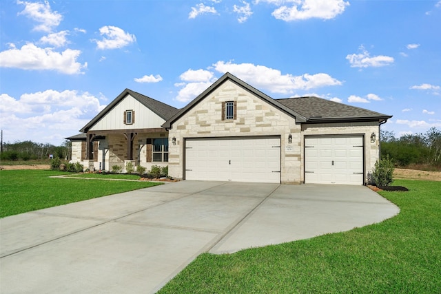 view of front of house featuring a front lawn and a garage