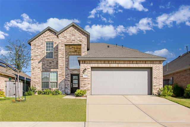 view of front facade featuring a front yard and a garage