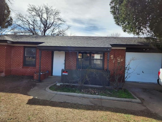 ranch-style house featuring a garage