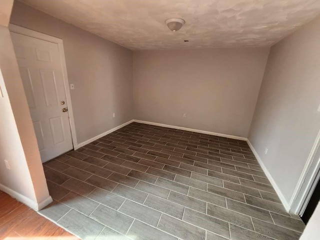 empty room featuring dark wood-type flooring