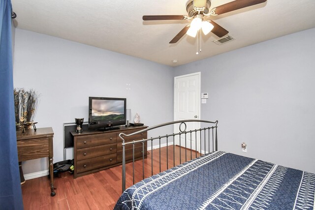 bedroom featuring hardwood / wood-style flooring and ceiling fan