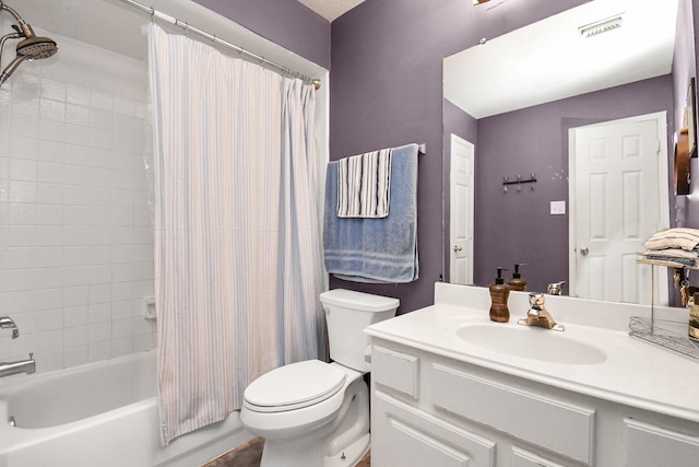 full bathroom with shower / tub combo, vanity, and toilet