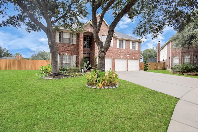 view of front of home with a garage and a front lawn