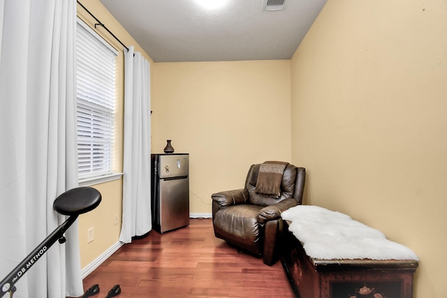 sitting room with dark hardwood / wood-style floors