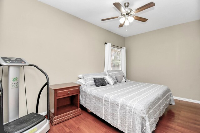 bedroom featuring dark hardwood / wood-style floors and ceiling fan