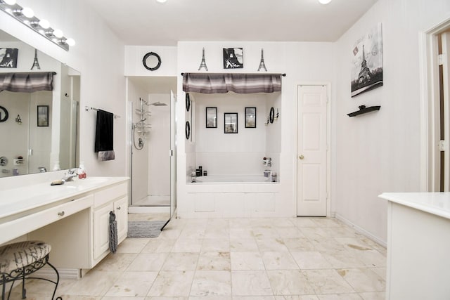 bathroom featuring vanity and independent shower and bath