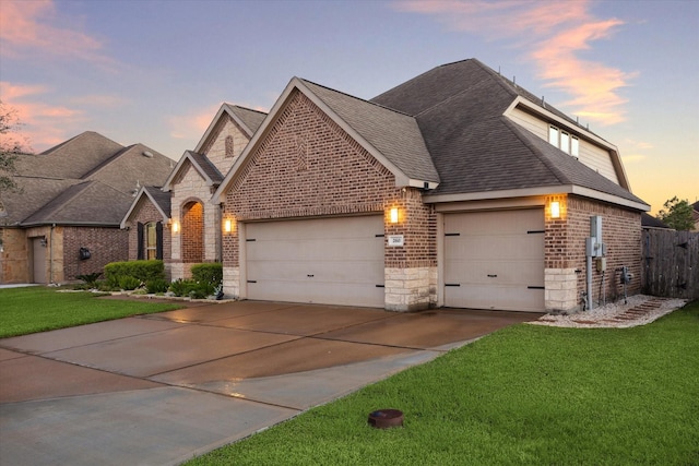 view of front facade featuring a yard and a garage