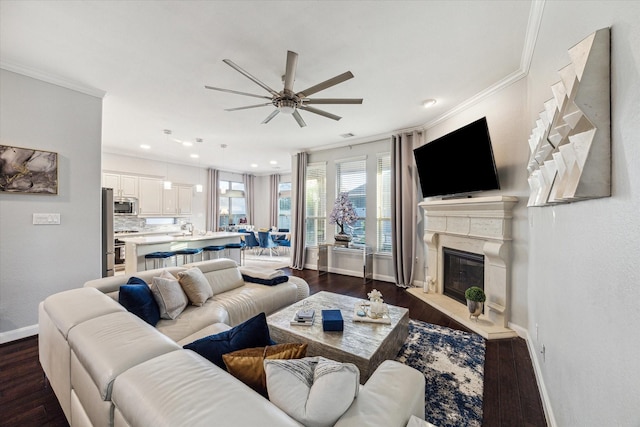 living room featuring crown molding, ceiling fan, and dark wood-type flooring