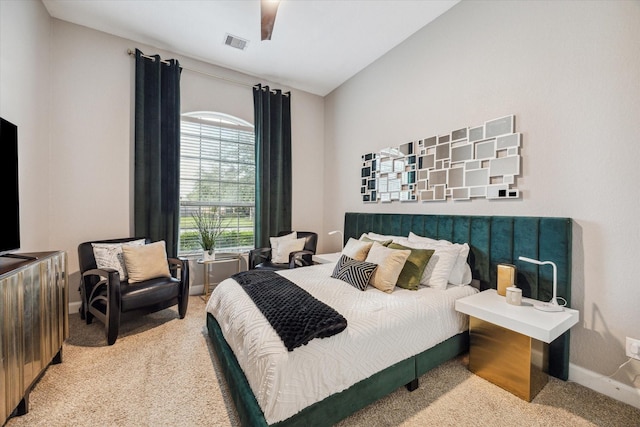 bedroom with carpet, ceiling fan, and vaulted ceiling