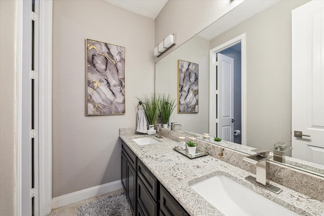 bathroom featuring tile patterned flooring and vanity