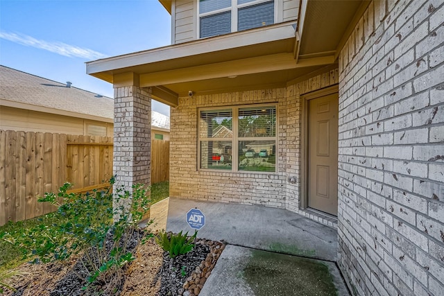 entrance to property featuring a patio area