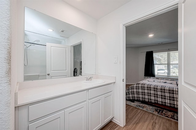 bathroom with vanity and wood-type flooring