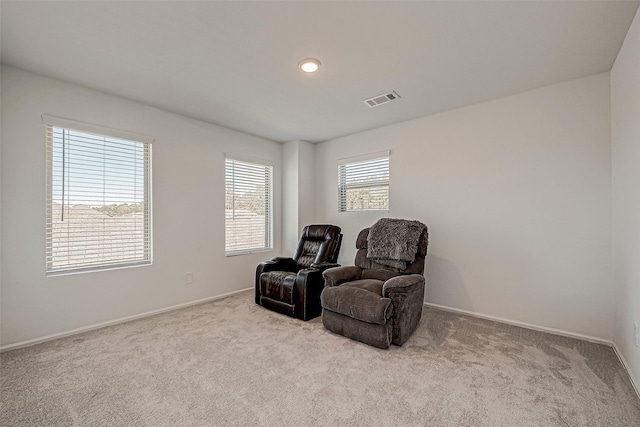 sitting room with light colored carpet