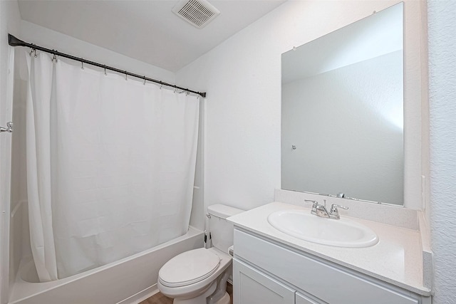 full bathroom featuring vanity, toilet, and shower / tub combo