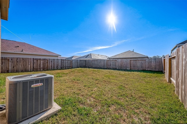 view of yard featuring central air condition unit