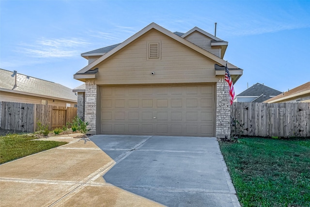 garage featuring a lawn