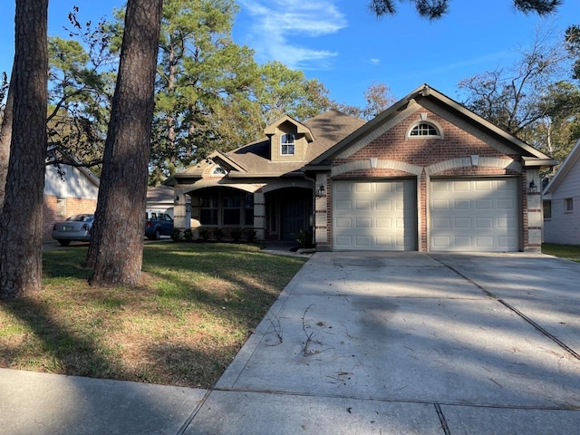 view of front facade with a garage and a front lawn