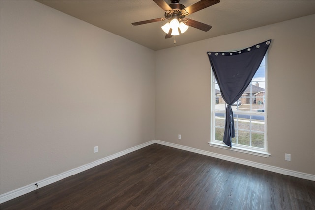 unfurnished room with ceiling fan and dark wood-type flooring