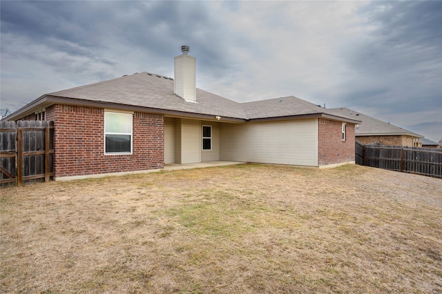 rear view of property featuring a patio