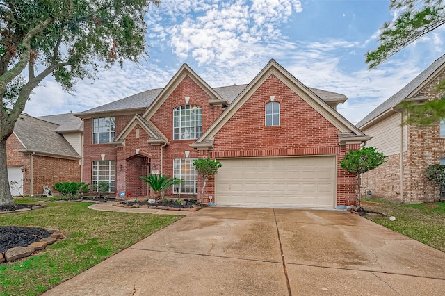 view of front property with a garage and a front lawn