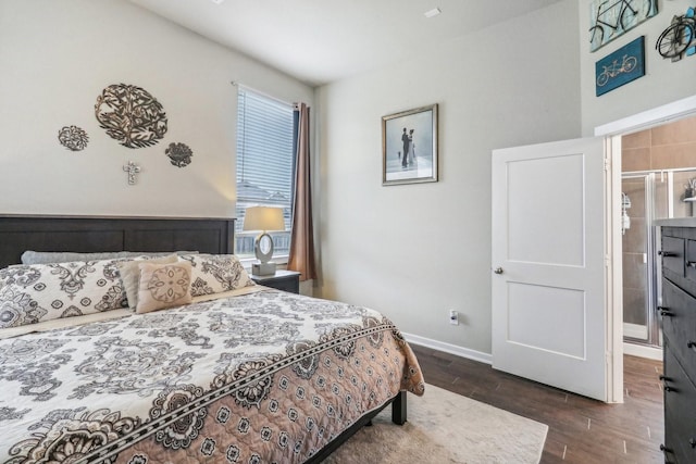 bedroom with dark hardwood / wood-style flooring