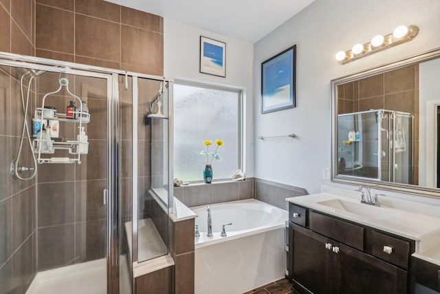 bathroom featuring separate shower and tub and vanity