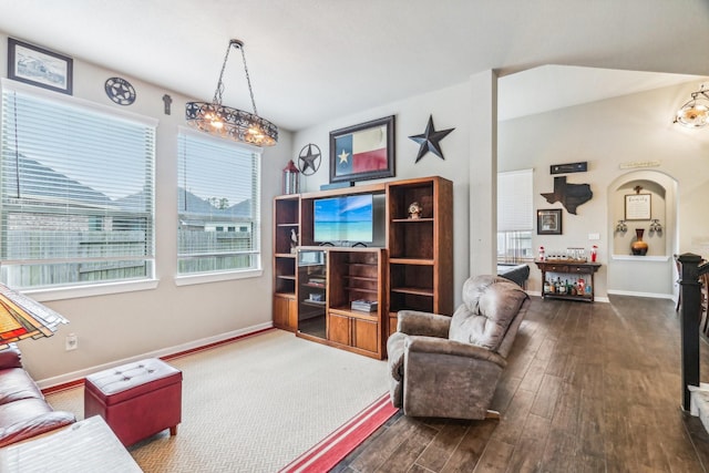 living room featuring dark hardwood / wood-style flooring and a notable chandelier