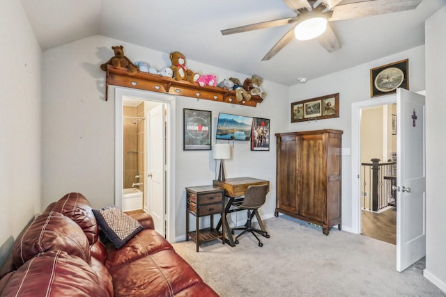 carpeted office with vaulted ceiling and ceiling fan