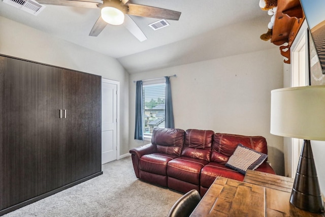 living room featuring light carpet, vaulted ceiling, and ceiling fan