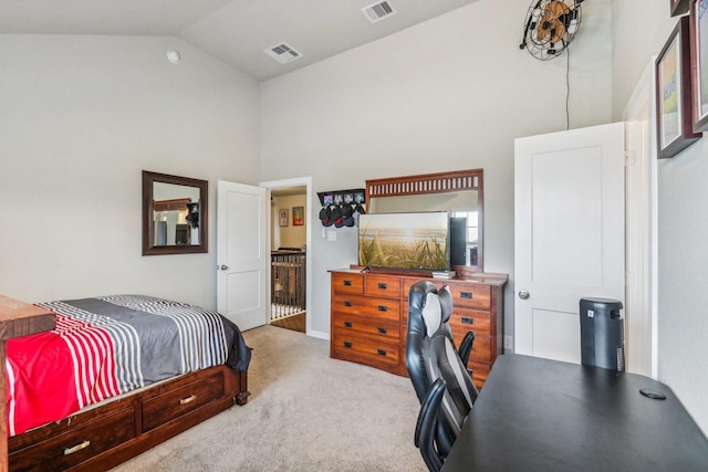 bedroom featuring light carpet and high vaulted ceiling