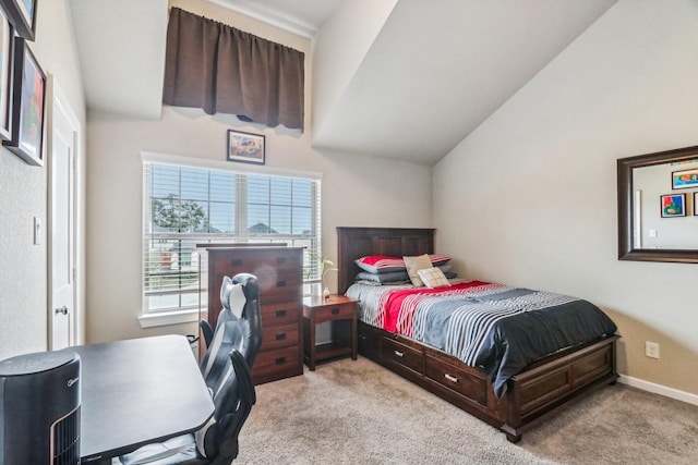 carpeted bedroom with vaulted ceiling