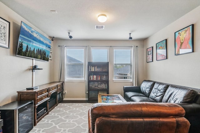 living room with a textured ceiling