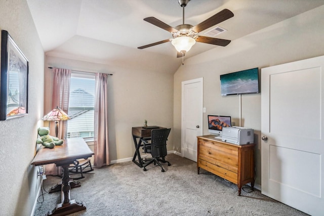 carpeted home office featuring vaulted ceiling and ceiling fan