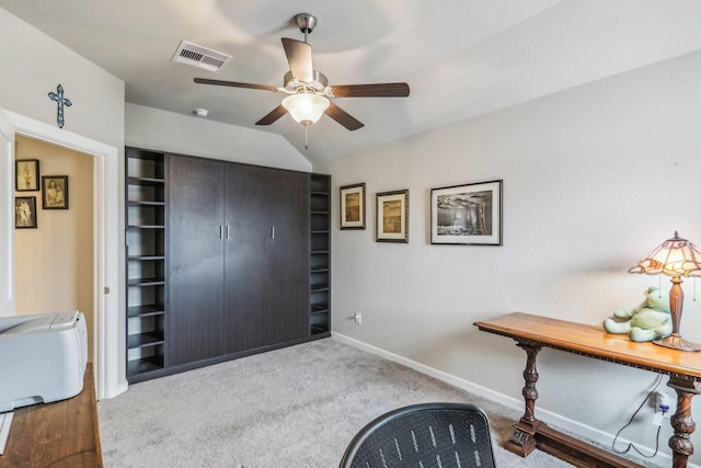 interior space featuring ceiling fan and lofted ceiling