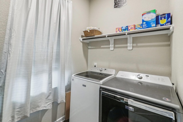 washroom featuring washer and dryer