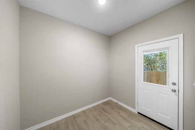 doorway to outside with light wood-type flooring