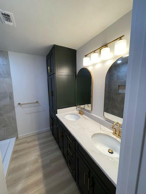 bathroom featuring vanity and wood-type flooring