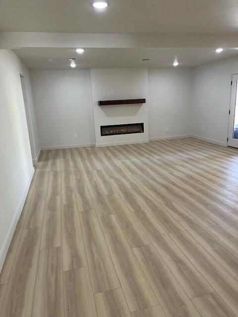 unfurnished living room featuring light wood-type flooring