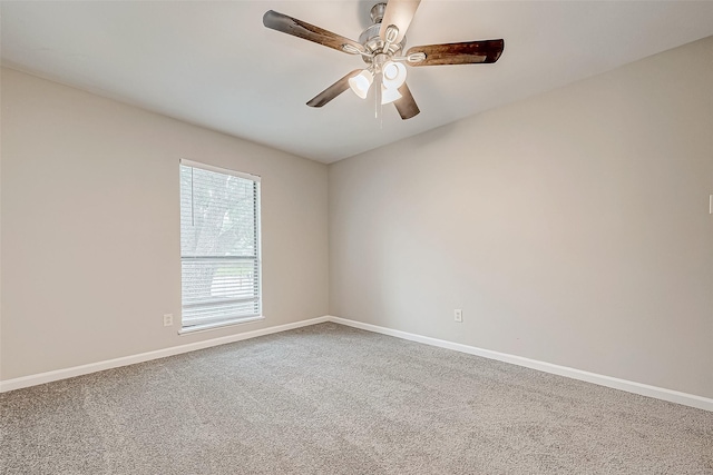 empty room featuring ceiling fan and carpet floors