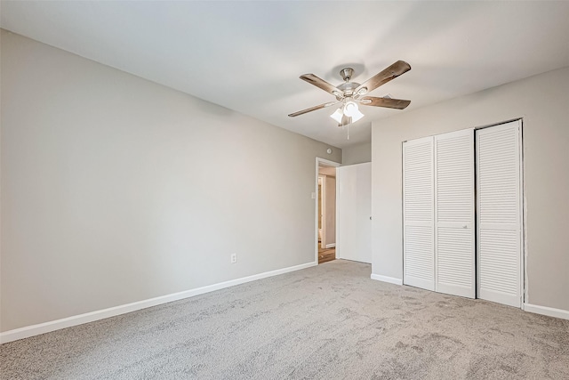 unfurnished bedroom with carpet flooring, ceiling fan, and a closet