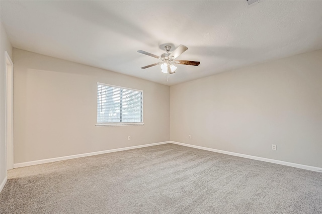 unfurnished room with carpet flooring, a textured ceiling, and ceiling fan