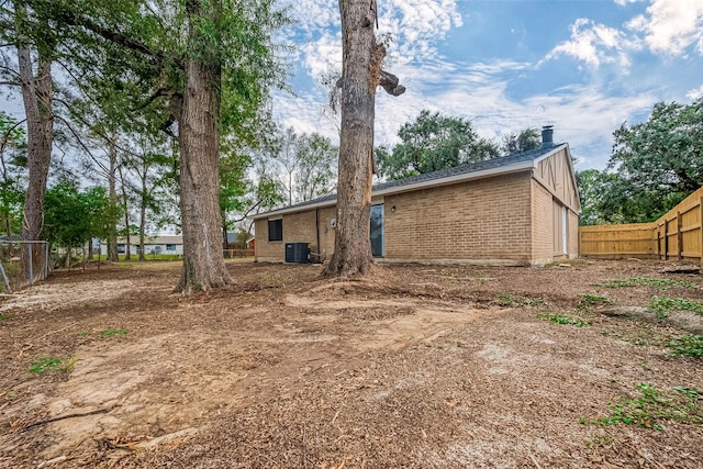 rear view of house with central AC unit