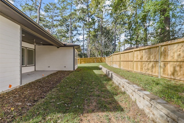 view of yard featuring a patio and ceiling fan