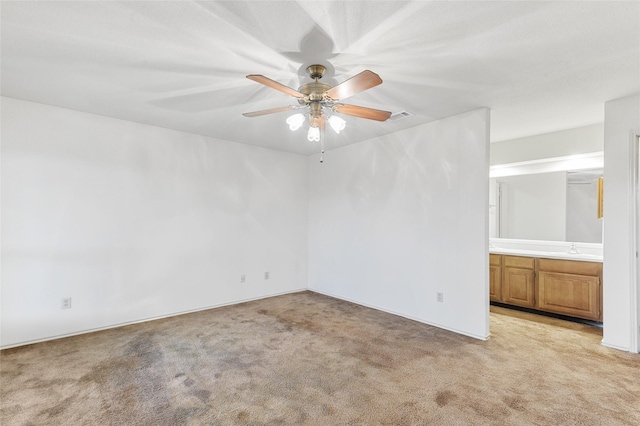 carpeted empty room with ceiling fan