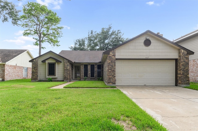 ranch-style home with a garage and a front lawn