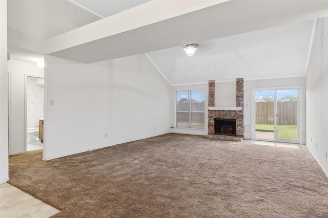 unfurnished living room featuring carpet flooring, a fireplace, and lofted ceiling