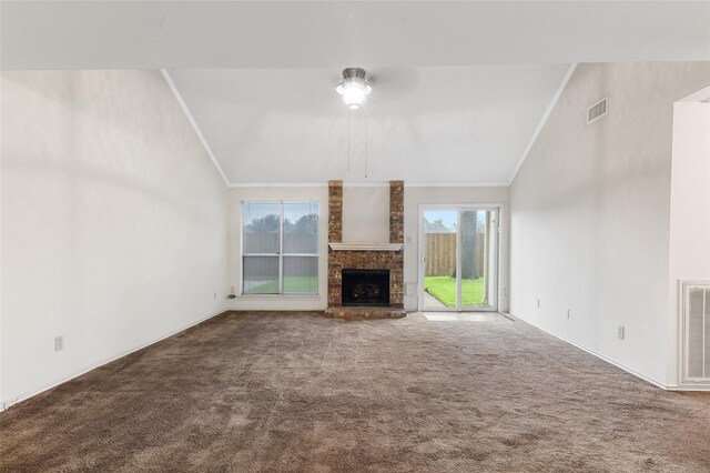 unfurnished living room featuring carpet flooring, plenty of natural light, and a brick fireplace