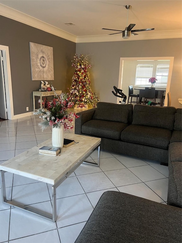 tiled living room featuring ceiling fan and crown molding