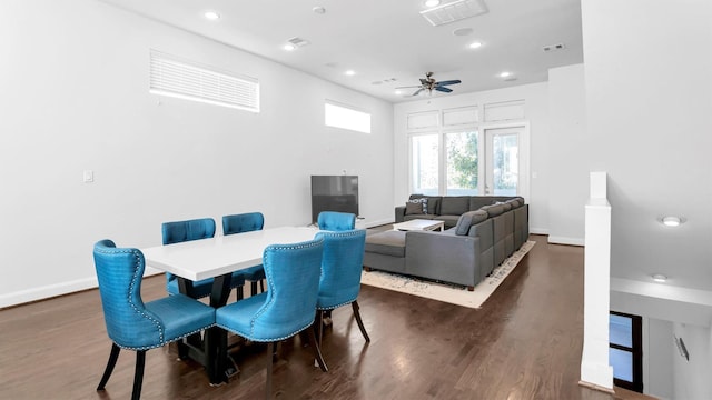 dining area with ceiling fan and dark hardwood / wood-style flooring