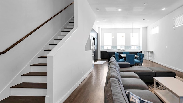 living room featuring dark wood-type flooring